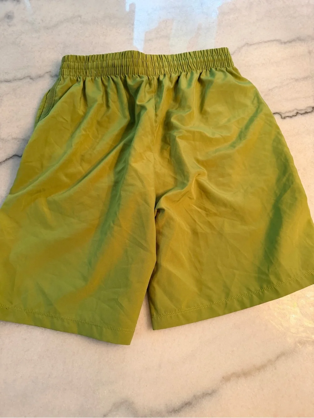 Youth Nike Green Athletic Shorts with White Swoosh